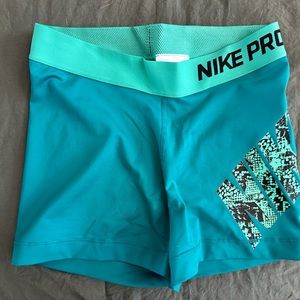 Nike Pro spandex shorts. Aqua with mint green around the band.  Size small.